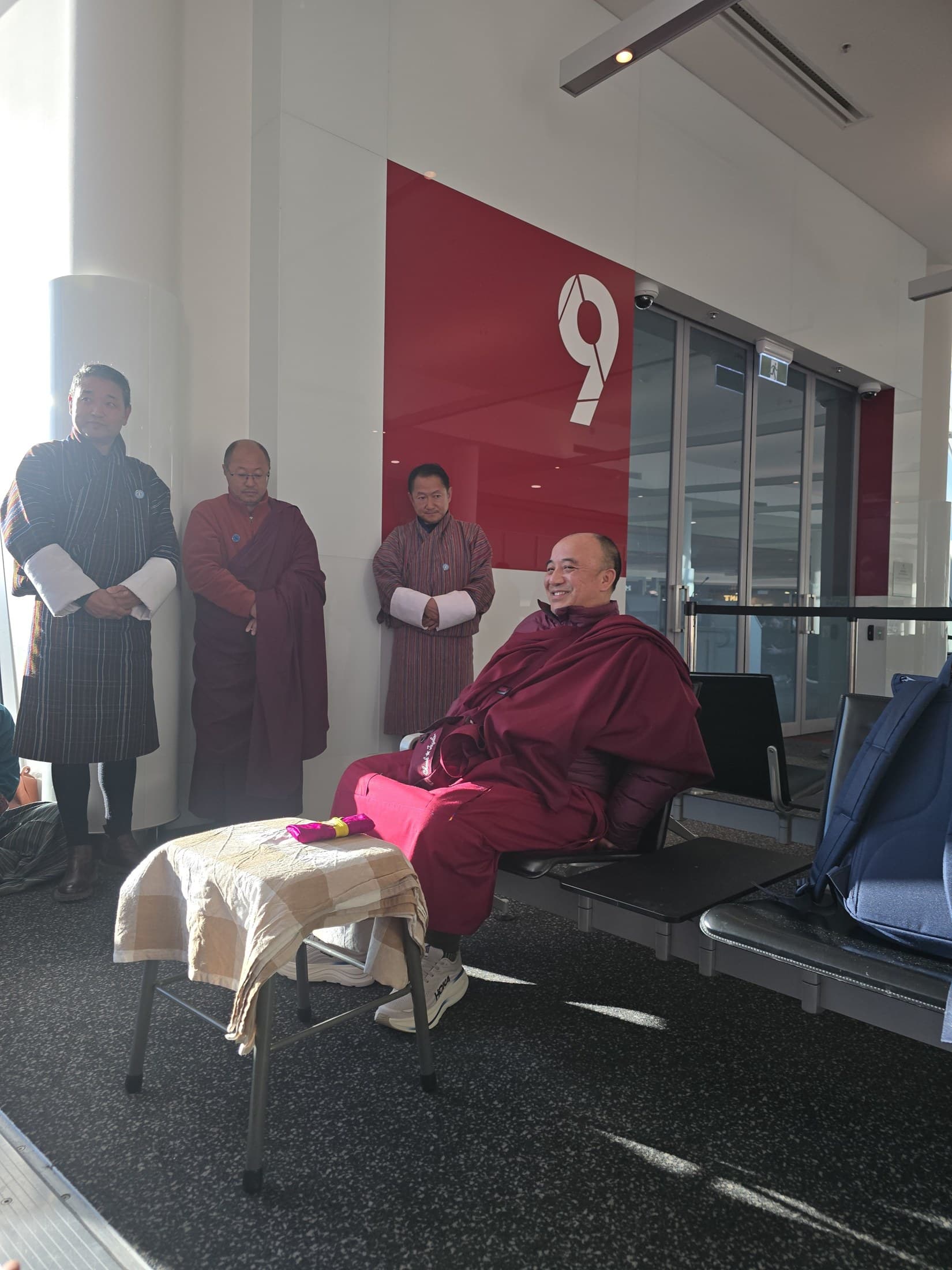 Kyabje Namkhai Nyingpo Rinpoche seated at Canberra Airport shortly before departing for Adelaide