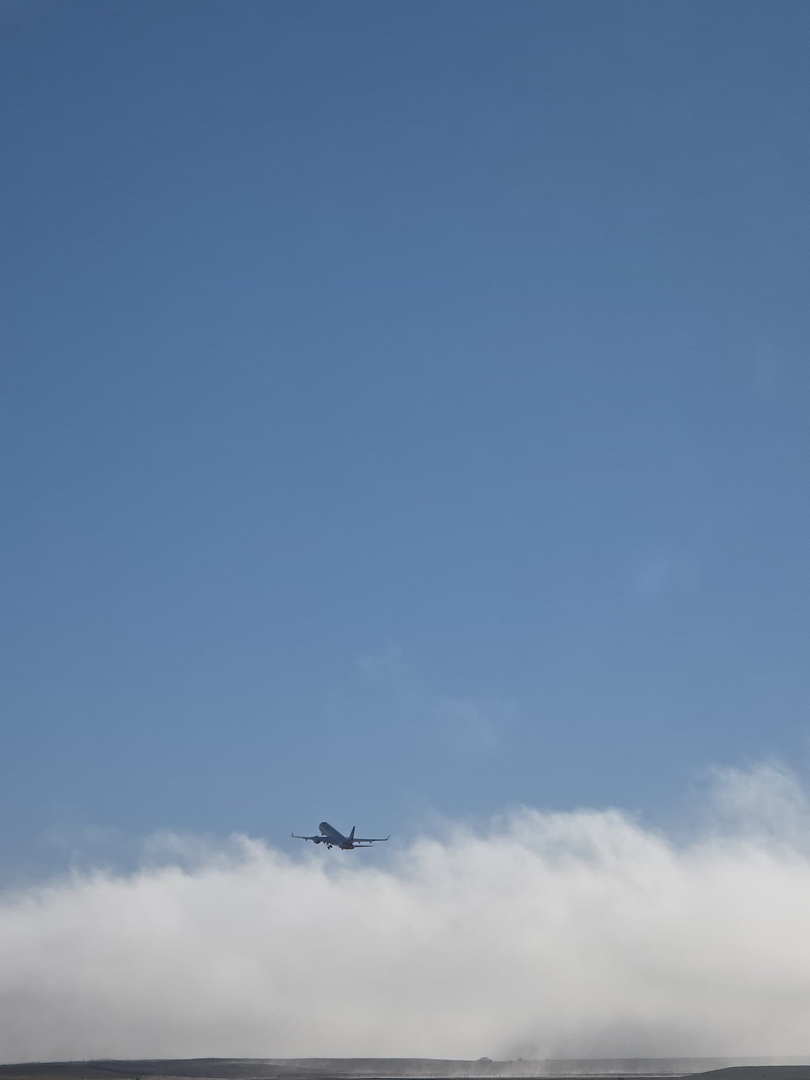 Aircraft carrying Kyabje Namkhai Nyingpo Rinpoche departing into the sky after leaving Canberra