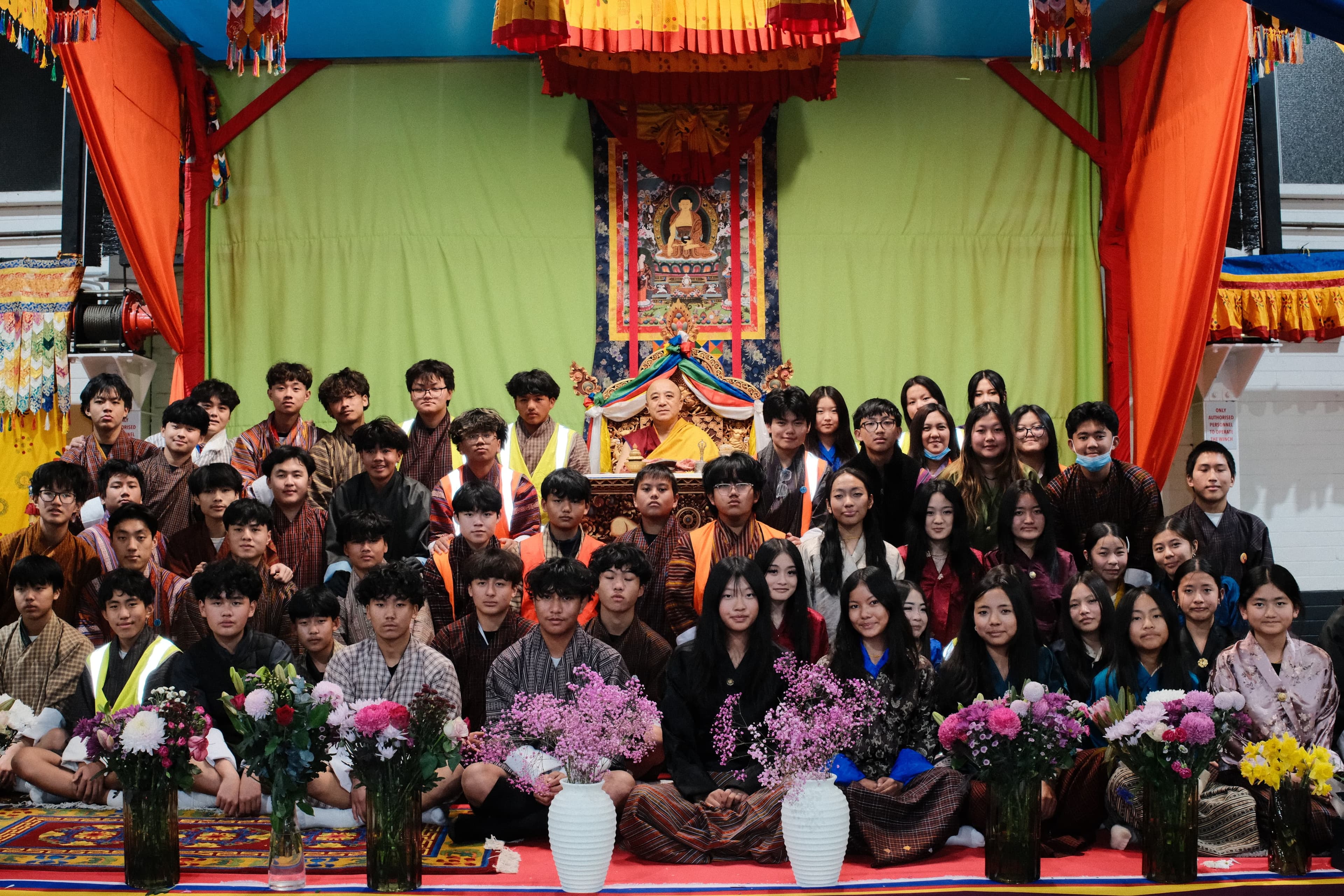 Youth volunteers pictured with Kyabje Namkhai Nyingpo Rinpoche after supporting the two-day programme